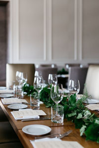 Close-up of wine glasses on table