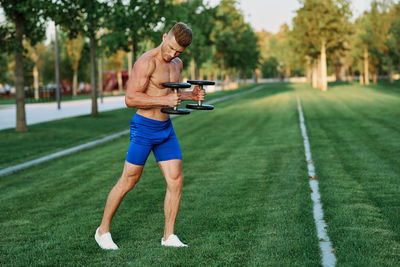 Full length of man wearing sunglasses on grass