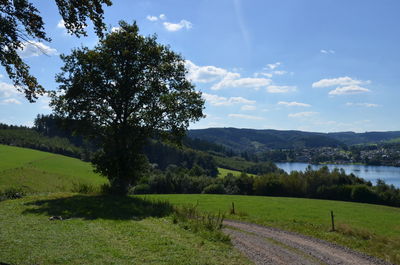 Scenic view of lake against cloudy sky