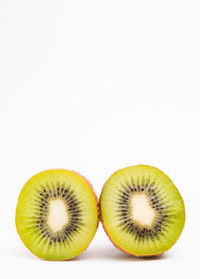 Close-up of fruits over white background