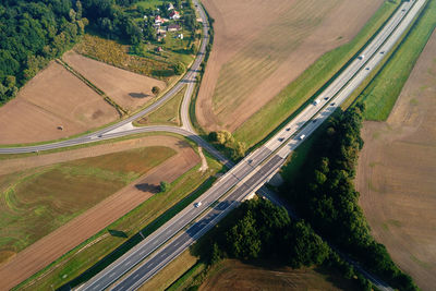 Car traffic on highway at summer day, aerial view