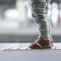 Low section of child standing on floor