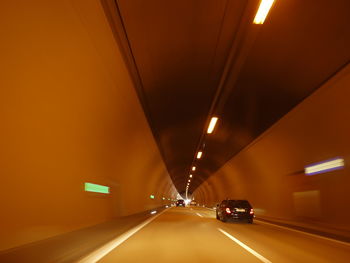 Illuminated tunnel in city