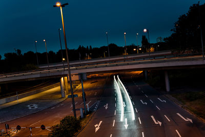 High angle view of light trails on road at night