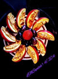 High angle view of fruits in plate on table