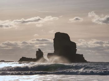 Tranquil stony bay in scotland after sunset. slow shutter speed for smooth water level and dreamy 