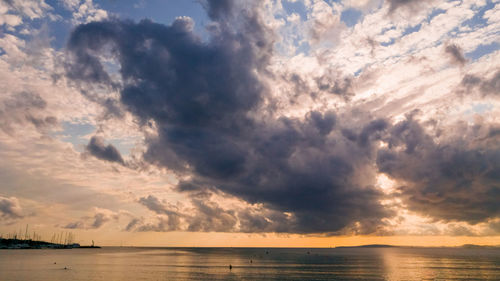 Scenic view of sea against dramatic sky