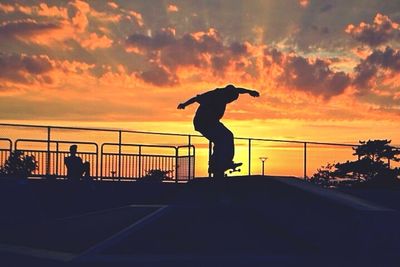 Silhouette of people at sunset