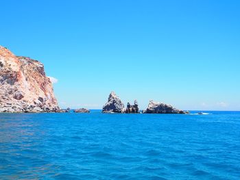 Scenic view of sea against clear blue sky