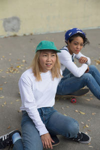 Two young women on skateboards