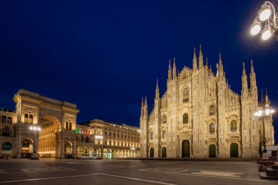 Illuminated building against sky at night