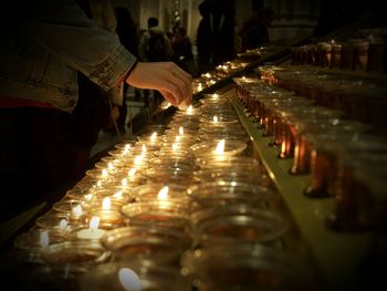 Illuminated candles in temple