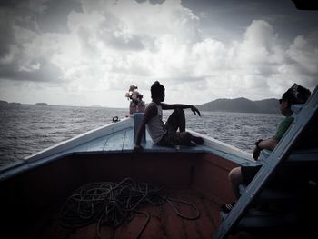 Scenic view of calm sea against cloudy sky