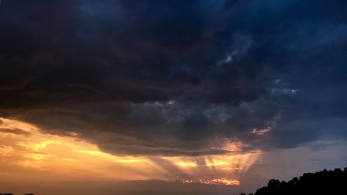 Low angle view of dramatic sky during sunset