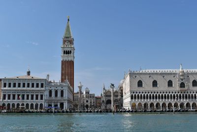 View of venice by canal against clear sky