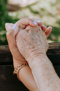 Cropped image of couple holding hands