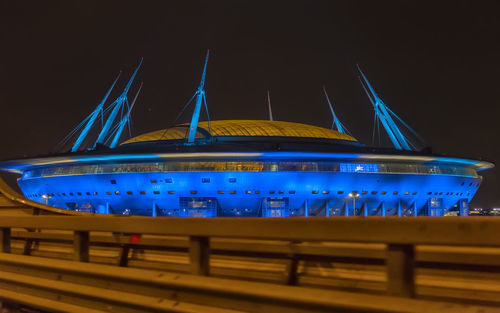 Low angle view of illuminated building against blue sky