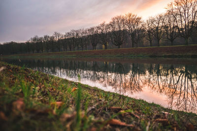 Scenic view of lake against sky during sunset