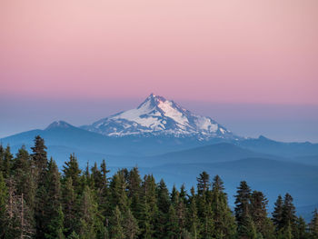 Scenic view of mountains against sky at sunset