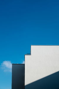 Low angle view of built structure against clear blue sky