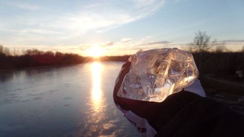 Close-up of reflection of man in water