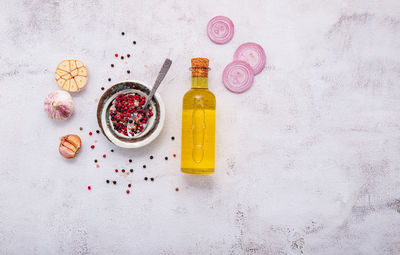 High angle view of various fruits on table against white background