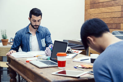 Men working at creative office