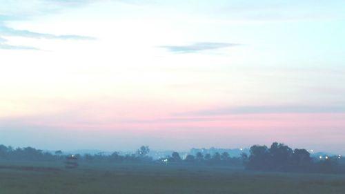 Scenic view of landscape against sky during sunset