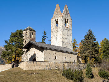 Low angle view of historic building against clear blue sky