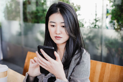 Young woman using mobile phone