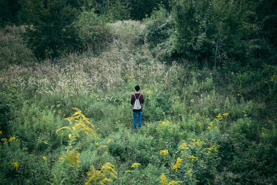 Woman standing on grass