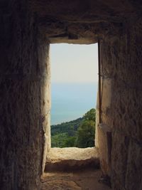 Scenic view of sea seen through arch window