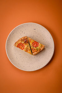 High angle view of food in plate on yellow background