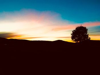 Scenic view of silhouette landscape against sky during sunset