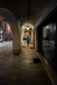 Rear view of man walking in building