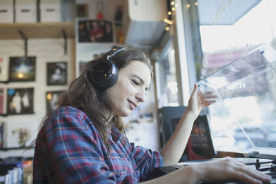 Young woman wearing headphones.