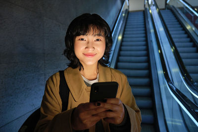 Young woman using mobile phone