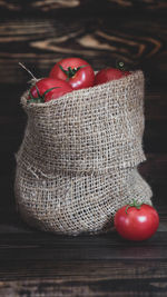 Close-up of tomatoes in basket on table