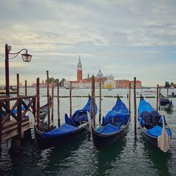 Gondolas on grand canal with church of san giorgio maggiore in background