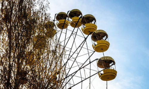 Low angle view of ferris wheel against sky