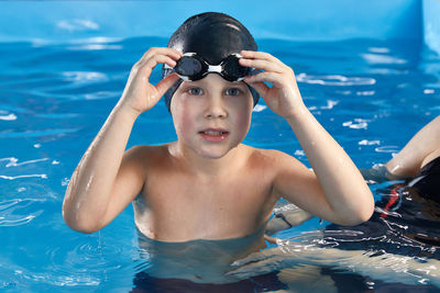 Portrait of woman swimming in pool