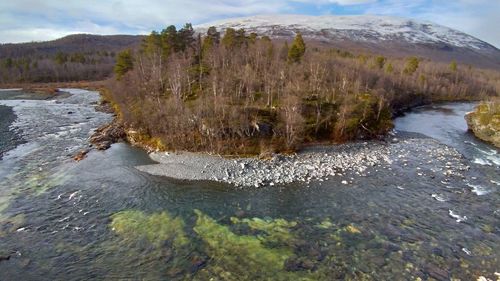 Scenic view of river flowing through rocks