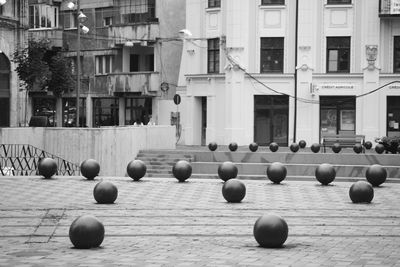 Row of ball and buildings in city