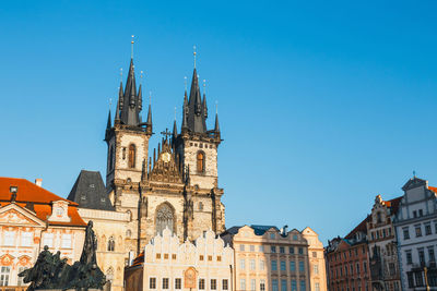 Low angle view of buildings against blue sky
