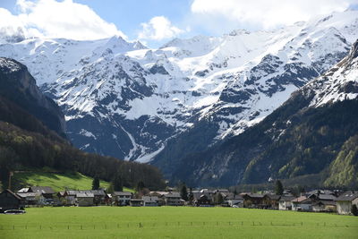 Scenic view of snowcapped mountains against sky