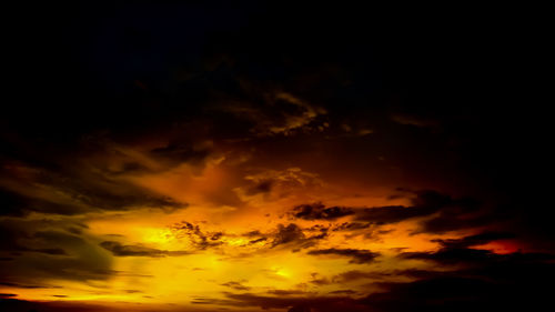 Low angle view of dramatic sky during sunset