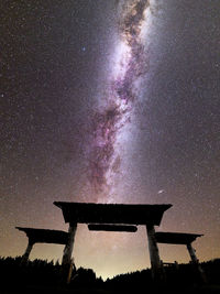 Low angle view of stars against sky at night