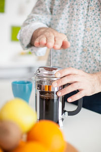 Midsection of man preparing food