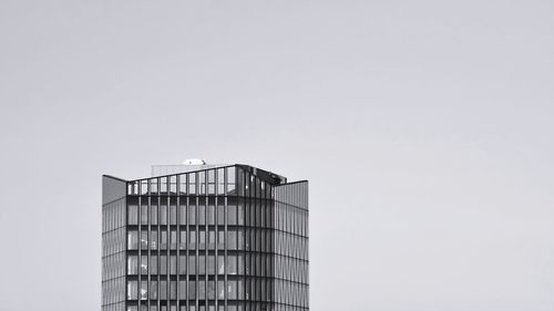 Low angle view of modern building against clear sky