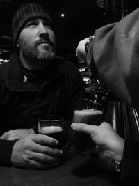 Midsection of man holding camera